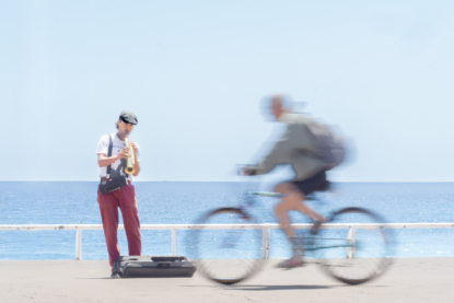 A musician plays his clarinette on a sunny afternoon creating a wonderful atmosphere to which many people stop while others just go past... ​(June 2017)